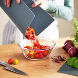 FINFÖRDELA Bendable chopping board, dark green/grey-turquoise, 28x36 cm